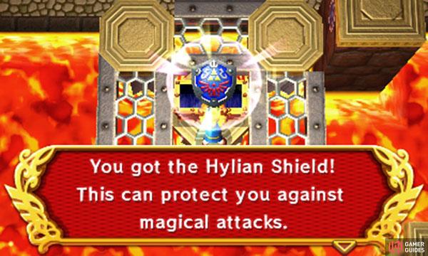 Next (B1 centre), merge into the wall immediately to the right. Walk right until you’re behind the long metal platform, then emerge to push it, creating a bridge below. Go down, across the bridge, and at the end, drop down to the left to reach the big chest–inside is the Hylian Shield.